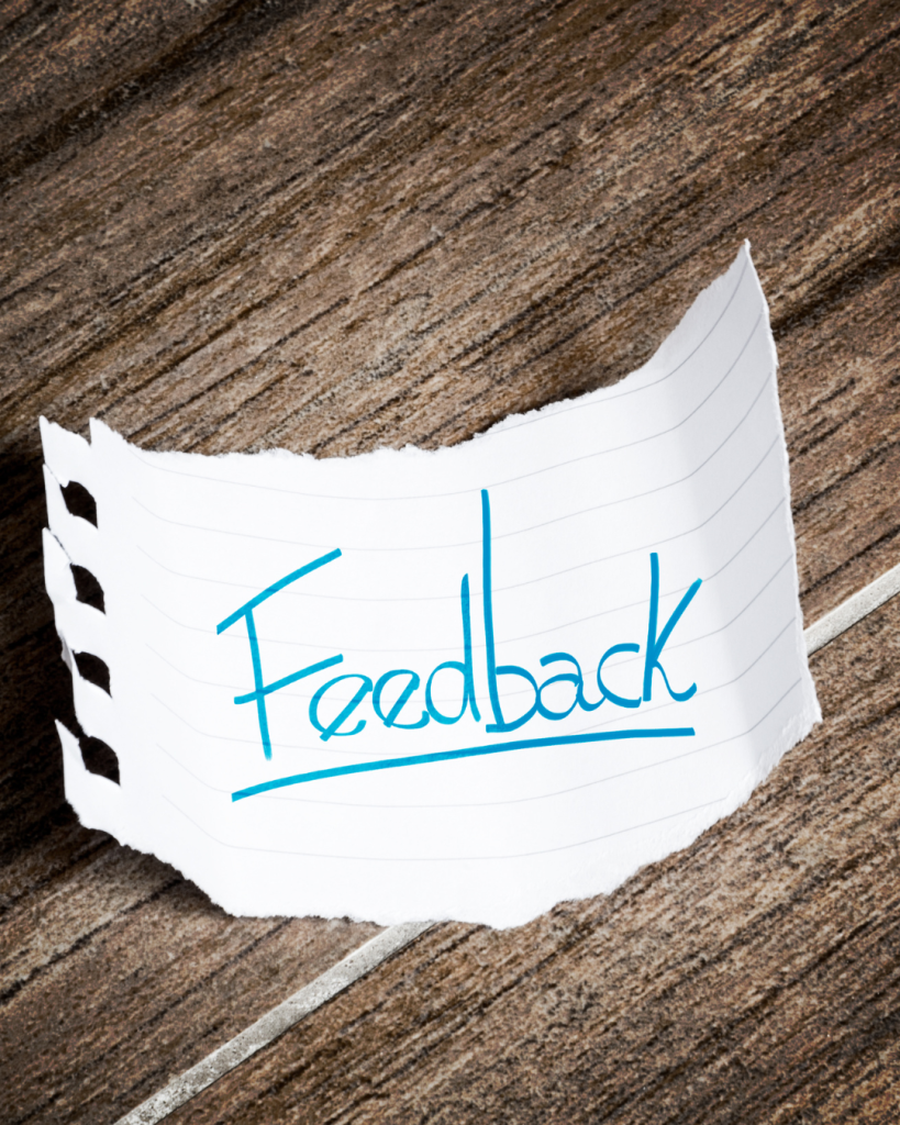 "Customer feedback note on wooden background representing client satisfaction with the best digital marketing agency services"